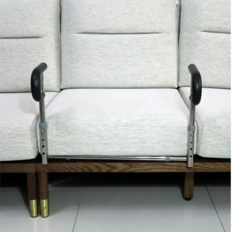 Person using SteadyRail handles to stand up from a sofa