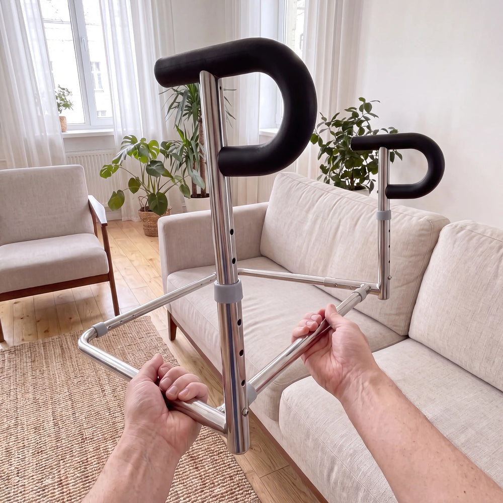 The SteadyRail dual-handle stand-assist rail held up, showing its adjustable stainless-steel frame